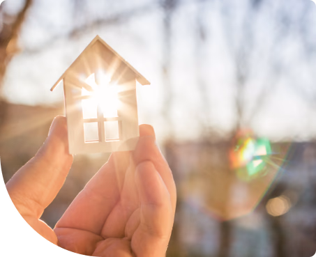 Hand holding a house into the sun to show how smart it is to choose us