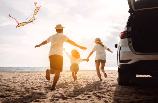 happy family playing on the beach